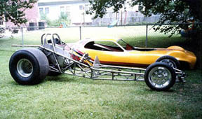The chassis has had upgrades since it was built. I'm guessing that it is '76-'78 vintage though it could be as new as '80-'82. The 118" wheelbase tells me the earlier year is closer. It is virtually identical to what I would build. There's the Satellite again. Since Dale Smith bought it and began stripping many layers of paint, he's discovered it to be one of the last Fighting Irish entries. A great find!